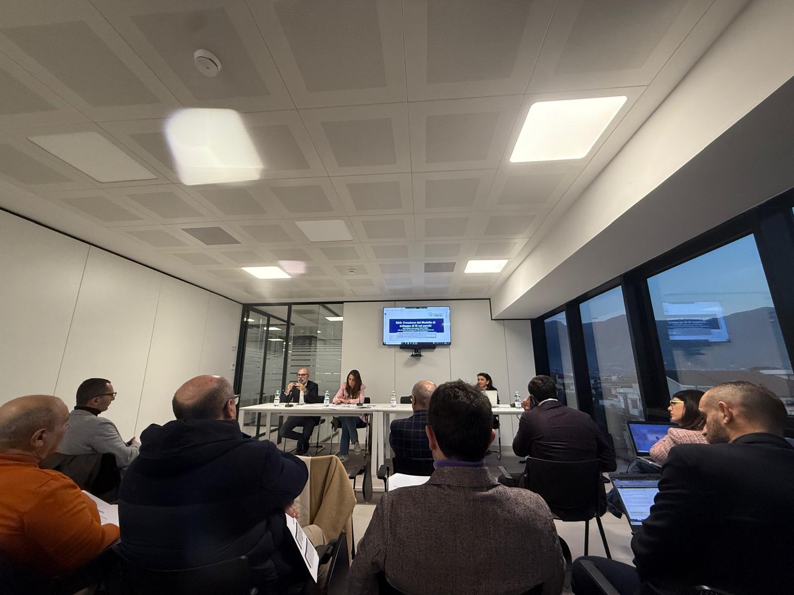 Stakeholder engagement meeting with local firms and researchers discussing industrial symbiosis at Fosso Imperatore