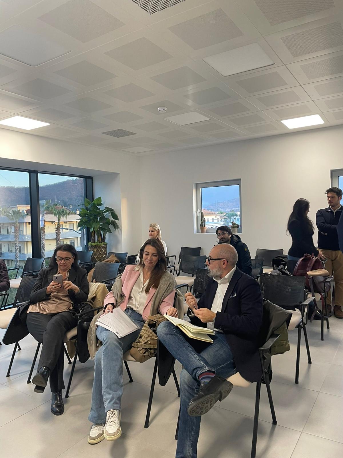 Attendees reviewing research documents during CE_IPsa project workshop at Fosso Imperatore Industrial Park